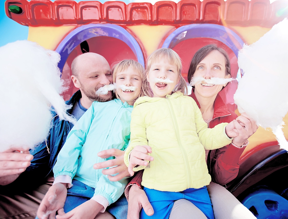 Family enjoying Day-to-Day Discounts at theme park