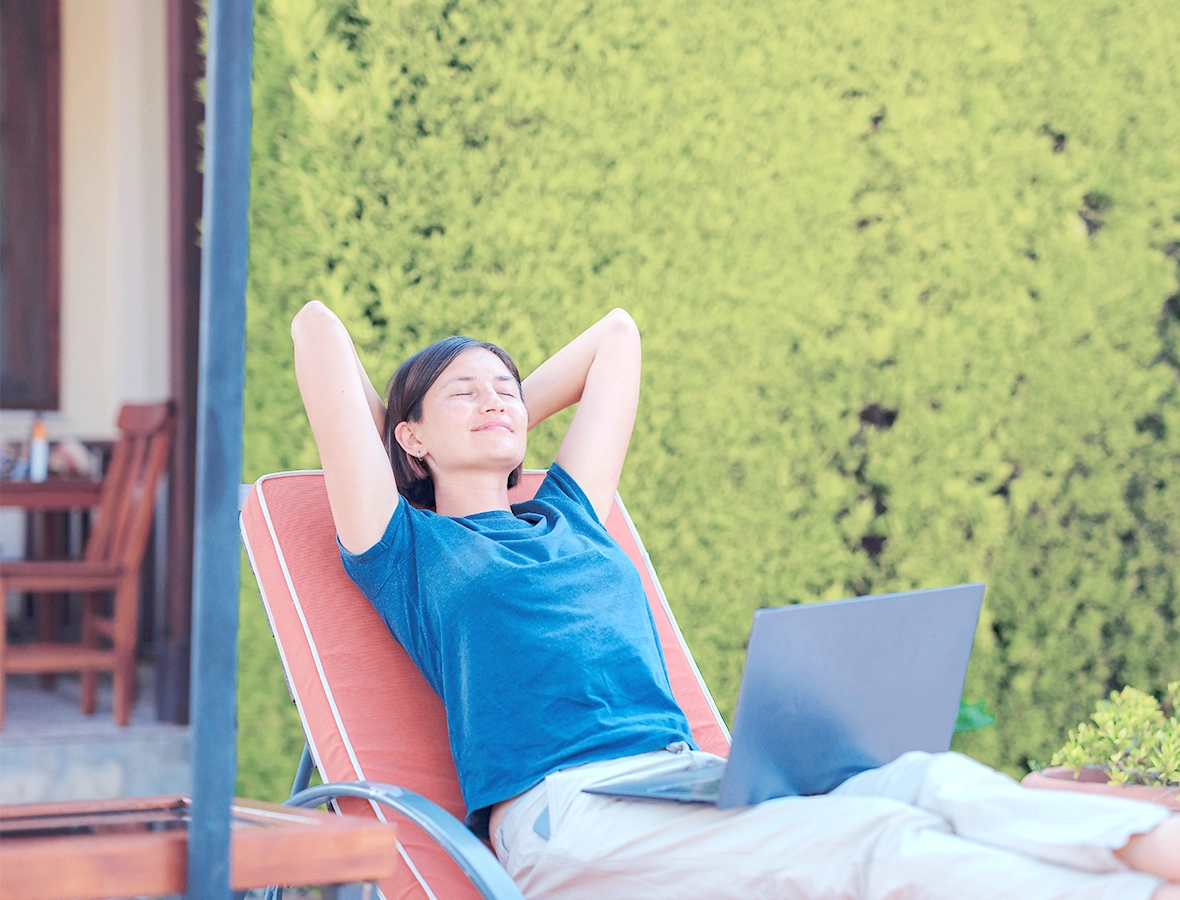 Woman relaxing because she learned how to start managing your debt.